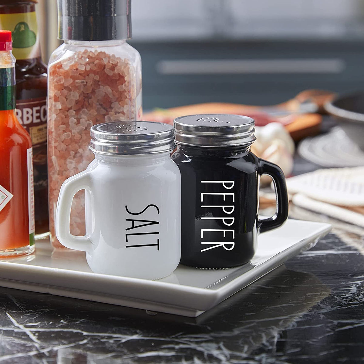 KITOME Salt and Pepper Shakers Set – Ceramic Spice Dispensers with Stainless Steel Lids & Handles, Black & White, 2-Piece Kitchen Dining Set